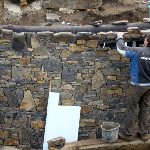 Solution of the natural wall of the bathing pond made of basalt