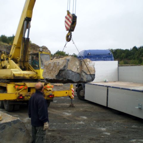 Loading basalt stones in the quarry weighing 3-7 tons